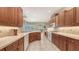 Traditional-style kitchen with warm wood cabinetry, ample counter space, and modern appliances at 7012 Treymore Ct, Sarasota, FL 34243