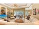 Bright living area with comfortable seating, natural light, and seamless access to the outdoor living space at 7012 Treymore Ct, Sarasota, FL 34243
