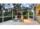 Outdoor patio with patio chairs and foliage at 7012 Treymore Ct, Sarasota, FL 34243
