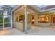Covered patio featuring pass-through to kitchen at 7012 Treymore Ct, Sarasota, FL 34243