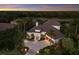 Beautiful single-story home showcasing a tile roof, manicured landscaping, water view, and private setting at 7211 Pasadena Gln, Lakewood Ranch, FL 34202