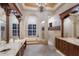 Elegant bathroom with a soaking tub, walk-in shower, and dual vanities at 7211 Pasadena Gln, Lakewood Ranch, FL 34202