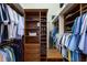 Walk-in closet with ample shelving, drawers, and hanging space at 7211 Pasadena Gln, Lakewood Ranch, FL 34202