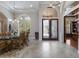 Dining room featuring decorative doors, tile floors, and large windows for natural light at 7211 Pasadena Gln, Lakewood Ranch, FL 34202