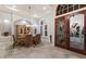 Dining room with a glass table, decorative glass doors, and an elegant chandelier at 7211 Pasadena Gln, Lakewood Ranch, FL 34202