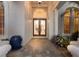 Beautiful entryway featuring decorative glass double doors, columns, and a brick walkway at 7211 Pasadena Gln, Lakewood Ranch, FL 34202
