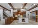 Spacious kitchen with wooden cabinets, stainless steel appliances, and a large island at 7211 Pasadena Gln, Lakewood Ranch, FL 34202