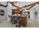 Bright kitchen boasts granite countertops and a central island with barstool seating at 7211 Pasadena Gln, Lakewood Ranch, FL 34202