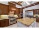 Well-appointed kitchen features stainless steel appliances, granite countertops, and custom cabinetry at 7211 Pasadena Gln, Lakewood Ranch, FL 34202