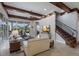 Bright living room features an adjacent staircase and outdoor living area at 7211 Pasadena Gln, Lakewood Ranch, FL 34202