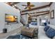 Spacious living room with open floor plan, wooden ceiling beams and staircase at 7211 Pasadena Gln, Lakewood Ranch, FL 34202
