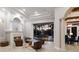 Open concept living area with fireplace, refined archways, and gorgeous views of the outdoor pool and entertainment space at 7211 Pasadena Gln, Lakewood Ranch, FL 34202