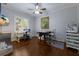 Spacious home office with hardwood floors, ample natural light, and a ceiling fan at 7211 Pasadena Gln, Lakewood Ranch, FL 34202