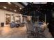 Extensive outdoor living space offering a shaded dining area, plush seating, and an outdoor grill at 7211 Pasadena Gln, Lakewood Ranch, FL 34202