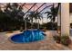 Screened pool area with brick pavers, spa, and tropical foliage creates a serene retreat at 7211 Pasadena Gln, Lakewood Ranch, FL 34202