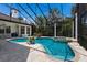 Luxurious pool area with a screened enclosure and landscaped patio at 7211 Pasadena Gln, Lakewood Ranch, FL 34202