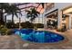 Screened pool area with brick pavers, spa, and view of the home's exterior at 7211 Pasadena Gln, Lakewood Ranch, FL 34202