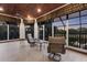 Enclosed sunroom boasts tile flooring and panoramic views with a wooden ceiling and fan at 7211 Pasadena Gln, Lakewood Ranch, FL 34202