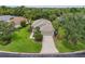 An aerial view of the home shows its well-manicured landscaping and convenient two-car garage at 7424 Sea Island Ln, Bradenton, FL 34201