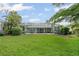 Spacious backyard with a screened-in lanai, perfect for enjoying the outdoors in comfort at 7424 Sea Island Ln, Bradenton, FL 34201