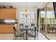 Bright breakfast nook featuring a glass table, slider door, and natural light at 7424 Sea Island Ln, Bradenton, FL 34201