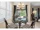 Charming breakfast nook with a glass table, a view of the lanai, and stylish window shutters at 7424 Sea Island Ln, Bradenton, FL 34201
