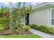 Close-up of the home's front entrance with a welcoming walkway and decorative landscaping at 7424 Sea Island Ln, Bradenton, FL 34201