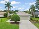 Charming one-story home with a well-manicured lawn and driveway leading to a two-car garage at 7424 Sea Island Ln, Bradenton, FL 34201