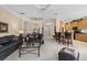 Open concept living room features vaulted ceilings, a ceiling fan, and flows seamlessly into the kitchen area at 7424 Sea Island Ln, Bradenton, FL 34201