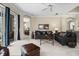 Bright living room with neutral carpet, blue curtains, and comfortable seating, perfect for relaxing and entertaining at 7424 Sea Island Ln, Bradenton, FL 34201