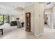 Inviting open-concept living room featuring tile floors, high ceilings, and a view of the pool area at 7424 Sea Island Ln, Bradenton, FL 34201