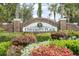 University Place community entrance sign, beautifully landscaped with vibrant plants and flowers at 7424 Sea Island Ln, Bradenton, FL 34201