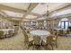 Expansive ballroom with elegant chandeliers, and neutral decor, ideal for hosting large celebrations and gatherings at 7717 Us Open Loop, Lakewood Ranch, FL 34202