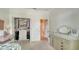 Bedroom featuring a large closet, neutral paint, and a dresser with mirror at 7717 Us Open Loop, Lakewood Ranch, FL 34202