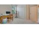 Bright bedroom with a large window and space for a desk or vanity at 7717 Us Open Loop, Lakewood Ranch, FL 34202