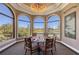 Enjoy panoramic views of the golf course from the charming breakfast nook with large windows and seating for six at 7717 Us Open Loop, Lakewood Ranch, FL 34202