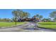 Expansive clubhouse with a welcoming driveway and ample parking, offering a premier destination for social gatherings and events at 7717 Us Open Loop, Lakewood Ranch, FL 34202