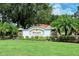 Welcoming Gleneagles community entrance with lush landscaping and stone accents, creating a serene and inviting atmosphere at 7717 Us Open Loop, Lakewood Ranch, FL 34202