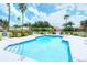 Refreshing community pool surrounded by lush landscaping, ideal for relaxation and recreation in a serene setting at 7717 Us Open Loop, Lakewood Ranch, FL 34202