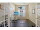 Bright workout room with black floor, large window and exercise equipment at 7717 Us Open Loop, Lakewood Ranch, FL 34202