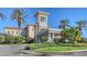 Upscale building features elegant architecture, manicured landscaping, and a covered entrance at 7717 Us Open Loop, Lakewood Ranch, FL 34202