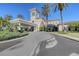 Impressive building showcases refined architecture, lush landscaping, and a welcoming covered entrance at 7717 Us Open Loop, Lakewood Ranch, FL 34202