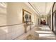Bright hallway features ornate mirror, marble floors, and elegant architectural details at 7717 Us Open Loop, Lakewood Ranch, FL 34202