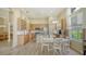 Open kitchen features stainless appliances, light wood cabinets, and breakfast area at 7717 Us Open Loop, Lakewood Ranch, FL 34202