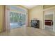Living area features an adjacent outdoor lanai and piano, along with hardwood floors at 7717 Us Open Loop, Lakewood Ranch, FL 34202