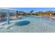 Outdoor pool area featuring a fountain and lounge seating under umbrellas on a sunny day at 7717 Us Open Loop, Lakewood Ranch, FL 34202