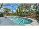 Inviting screened-in pool with lush tropical landscaping, perfect for outdoor enjoyment at 7717 Us Open Loop, Lakewood Ranch, FL 34202