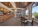 Inviting restaurant and bar area with comfortable seating and abundant natural light from the large windows at 7717 Us Open Loop, Lakewood Ranch, FL 34202