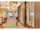 Well stocked wine cellar with ladder for accessing upper shelves, an amazing place to store your collection at 7717 Us Open Loop, Lakewood Ranch, FL 34202
