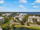 Aerial view of the condo community near the water with lush trees and landscaping at 7840 34Th Ave W # 303, Bradenton, FL 34209